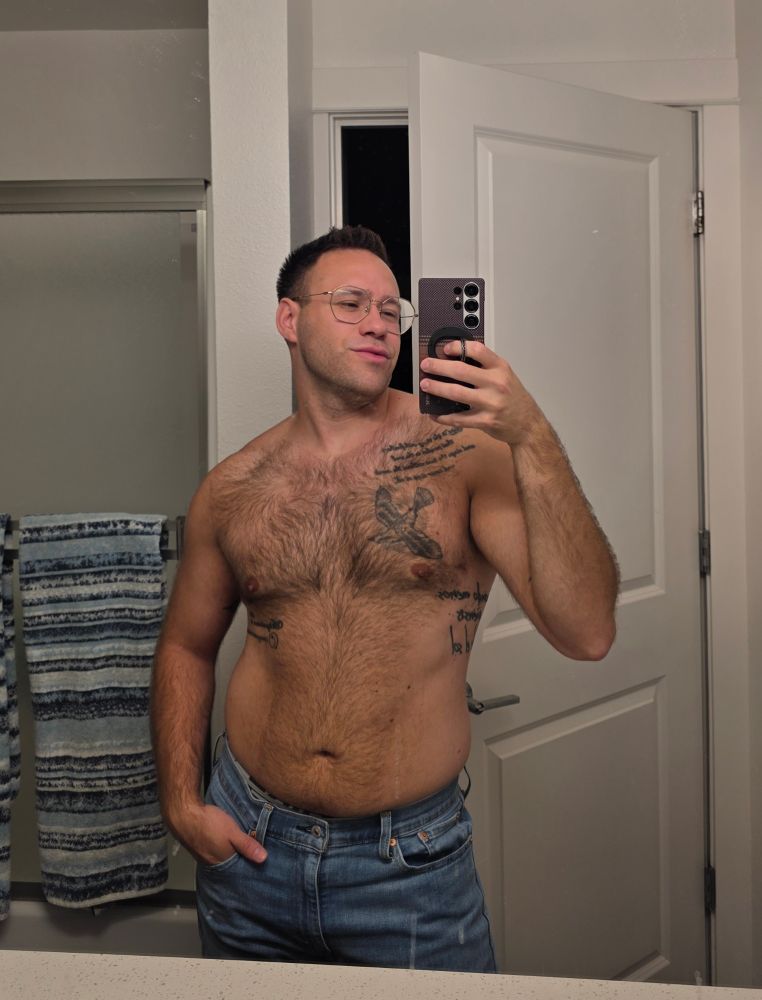 Jaws taking shirtless mirror selfie while wearing jeans