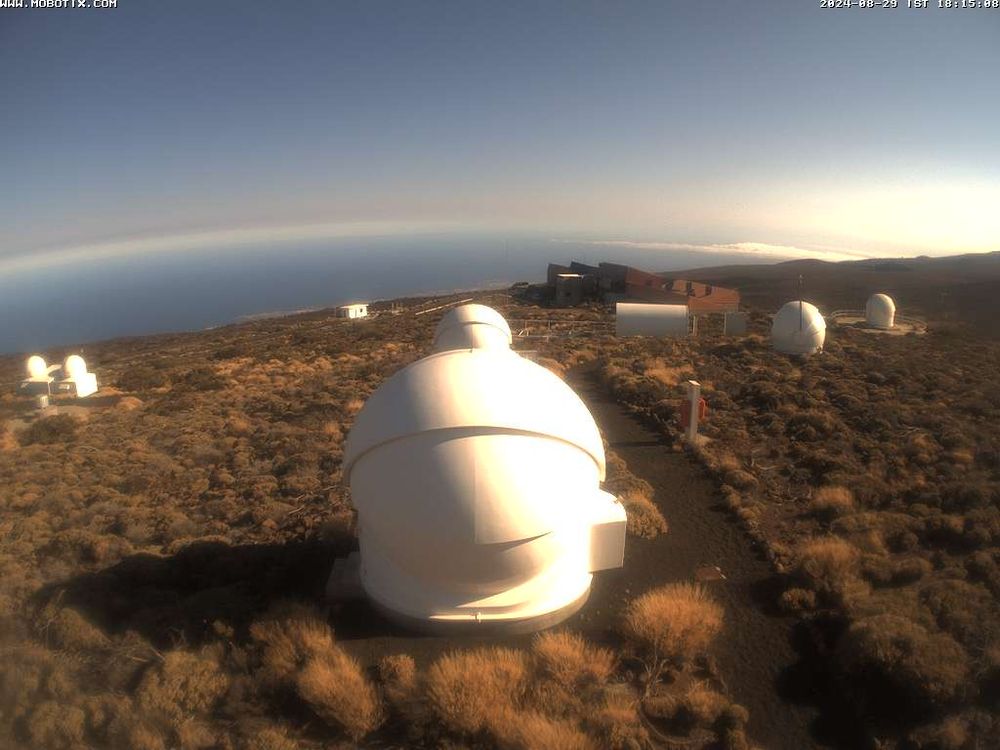 Webcam still looking down on PIRATE and COAST domes on a sunny evening.