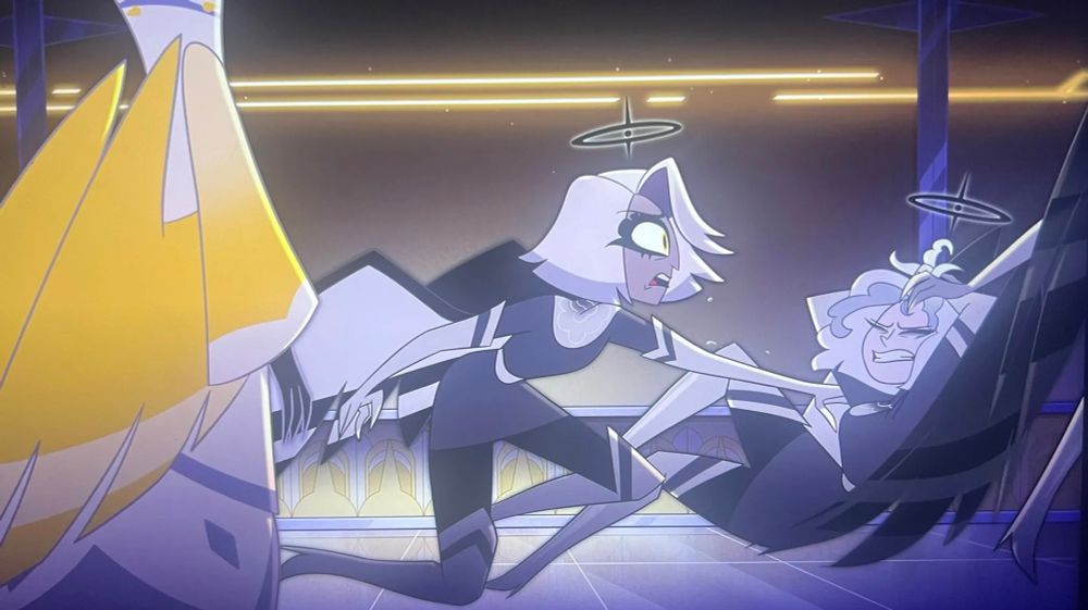 Vaggie, in her exorcist days, tries to prevent another exorcist from being dragged off by Lute. Adam stands to the left