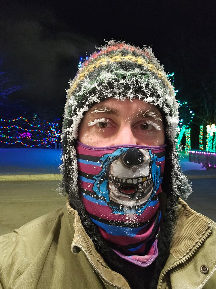Picture of a face with a winter mask plus frosted eyelahes and toque with frost all around. It was -29°C.