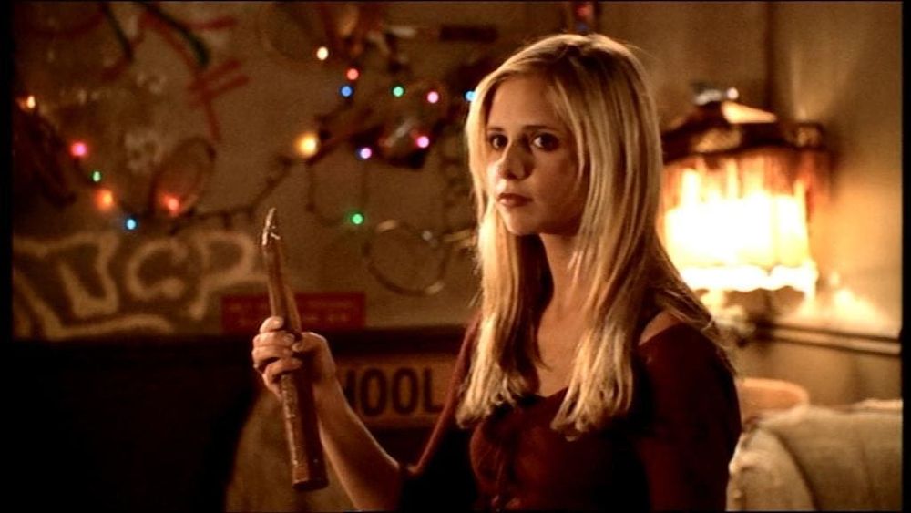 Buffy the vampire slayer holding a stake