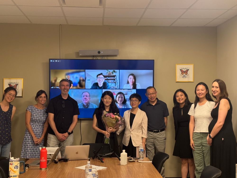 Yang with her committee, parents, and friends after her defense.