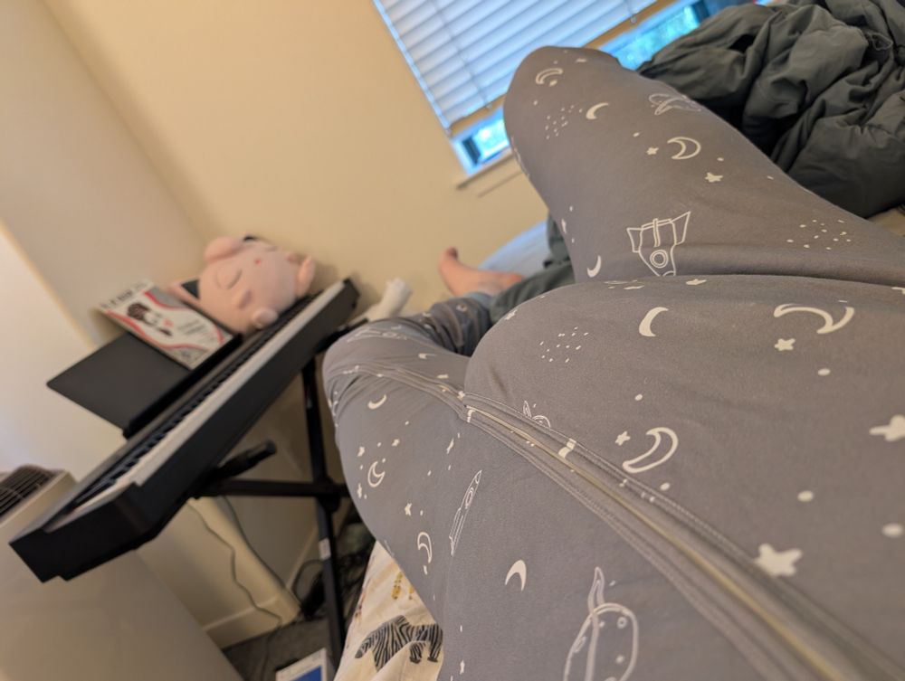 A big diaper in zip up space pjs