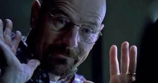 still of walter white with his hands up right after he says "you got me" to hank