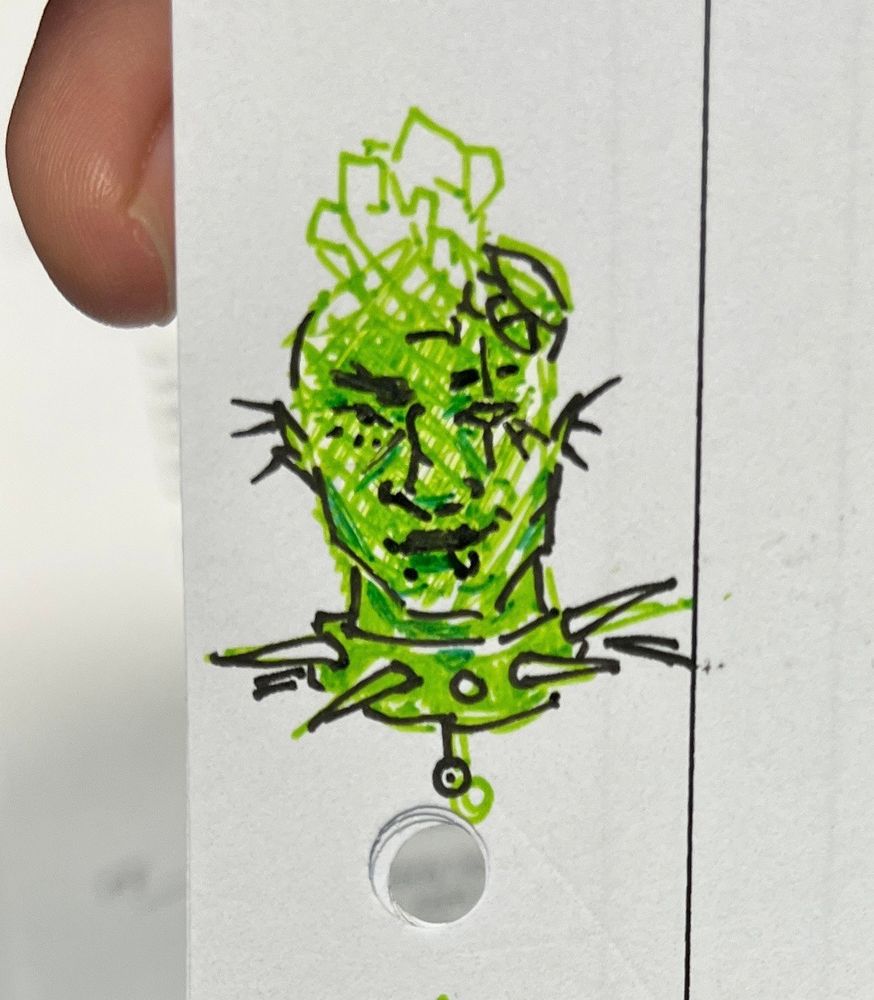 green pen drawing of ashton with a big ass spiked collar. 