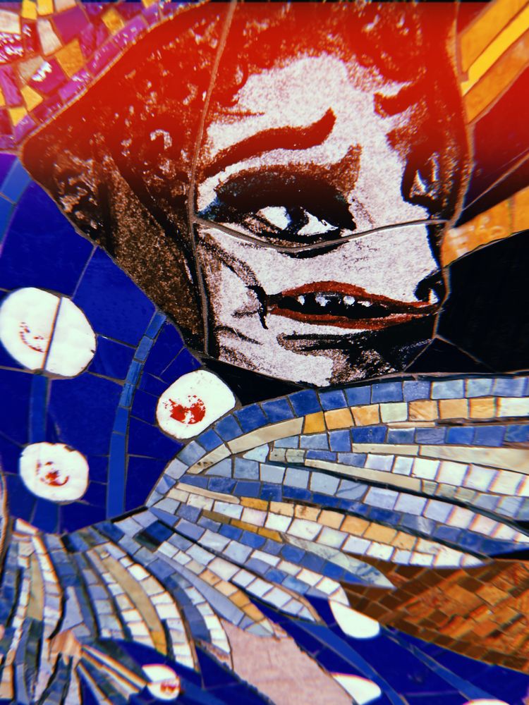 Subway art of a roughly painted rat lady. She’s wearing a full face of makeup and making a confused expression. 