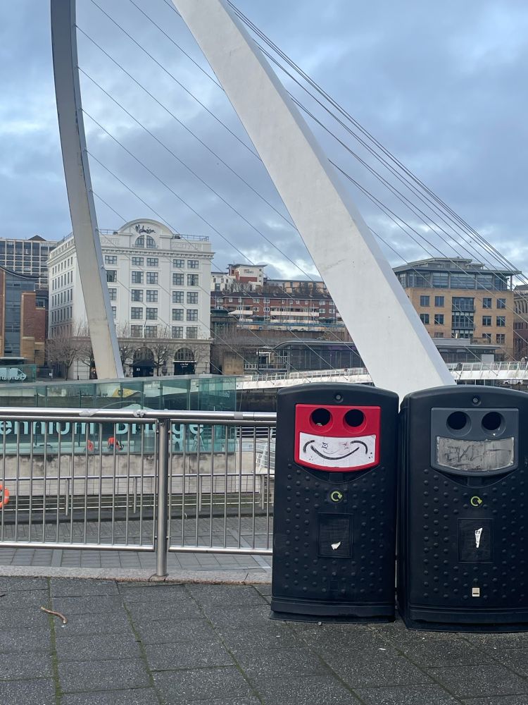 Bin with a smiley face drawn on. 