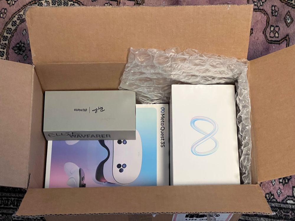 box containing a quest 3, quest 3s and meta rayban smart glasses
