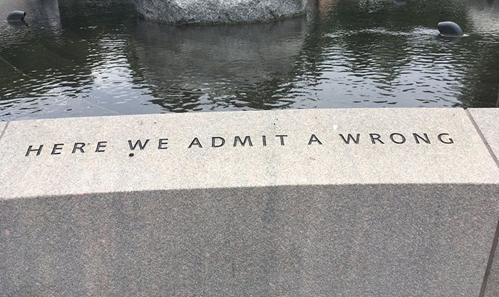 stone text inlay: HERE WE ADMIT A WRONG