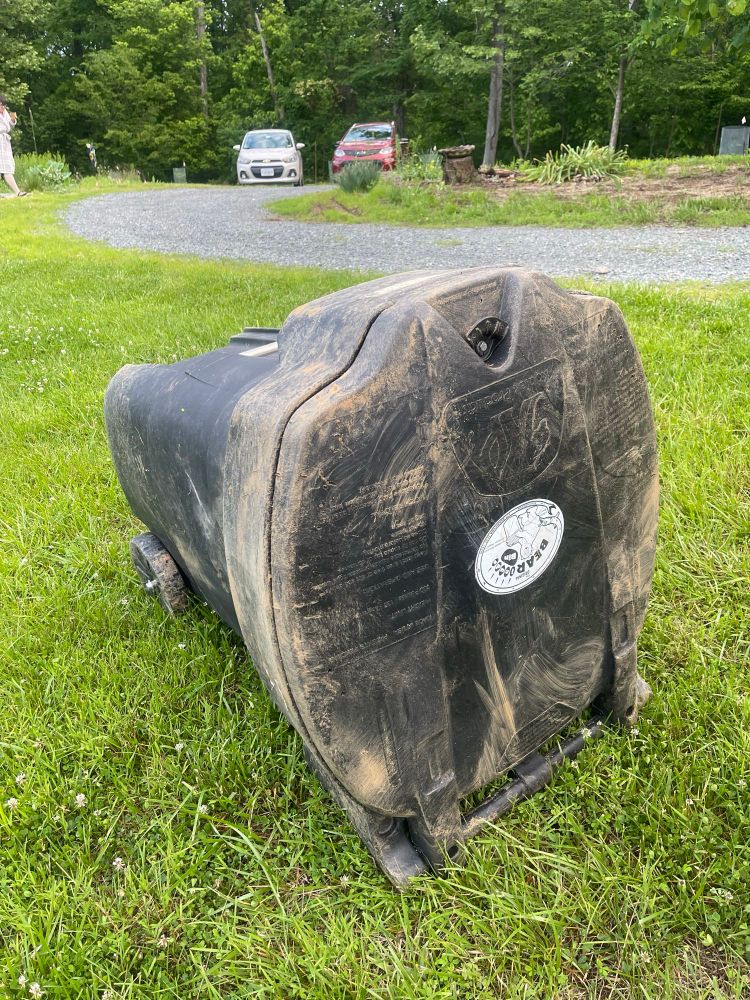 Bearicuda “bear proof” trashcan cover with mud and new scratches the morning after a bear encounter. 