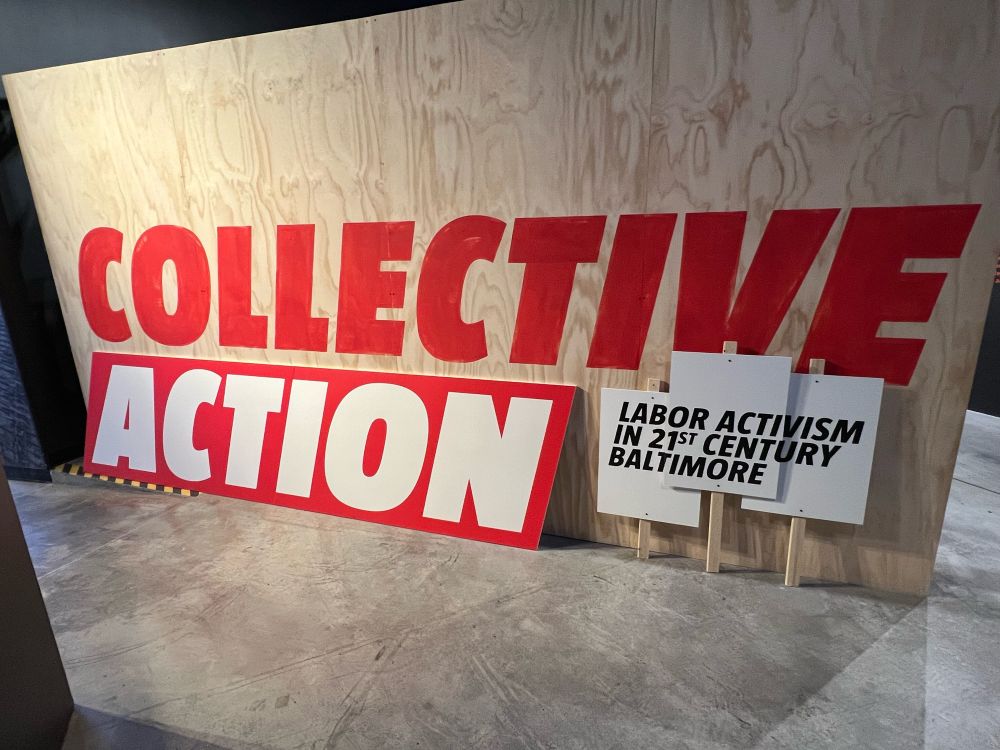 A picture of the exhibit that says in large letters “Collective Action: Labor Activism in 21st Century Baltimore.” 