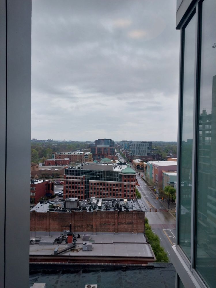 Window-view shot of downtown Columbus' rooftops, taken from the 12th floor of the Hilton Hotel