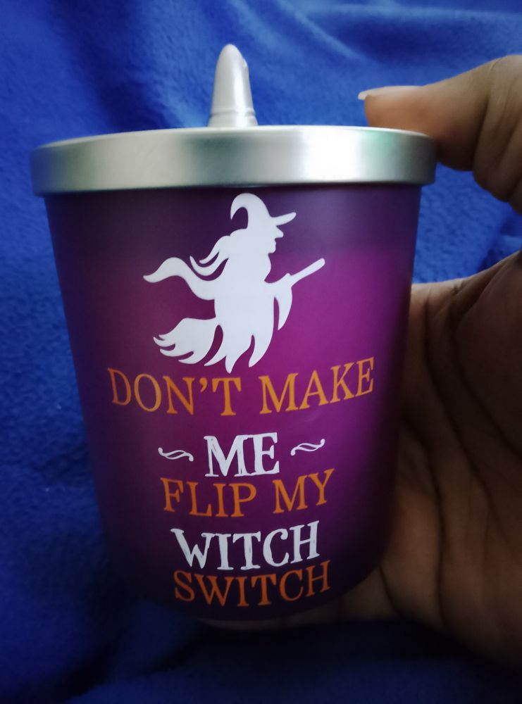A purple jarred candle. Writing on the candle reads: Don't Make Me Flip My Witch Switch.