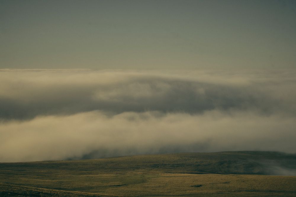 Low clouds hang over the flat plateau of northern Dartmoor