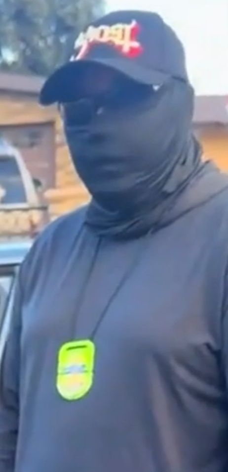 coward ice agent with every inch of his body and head covered up