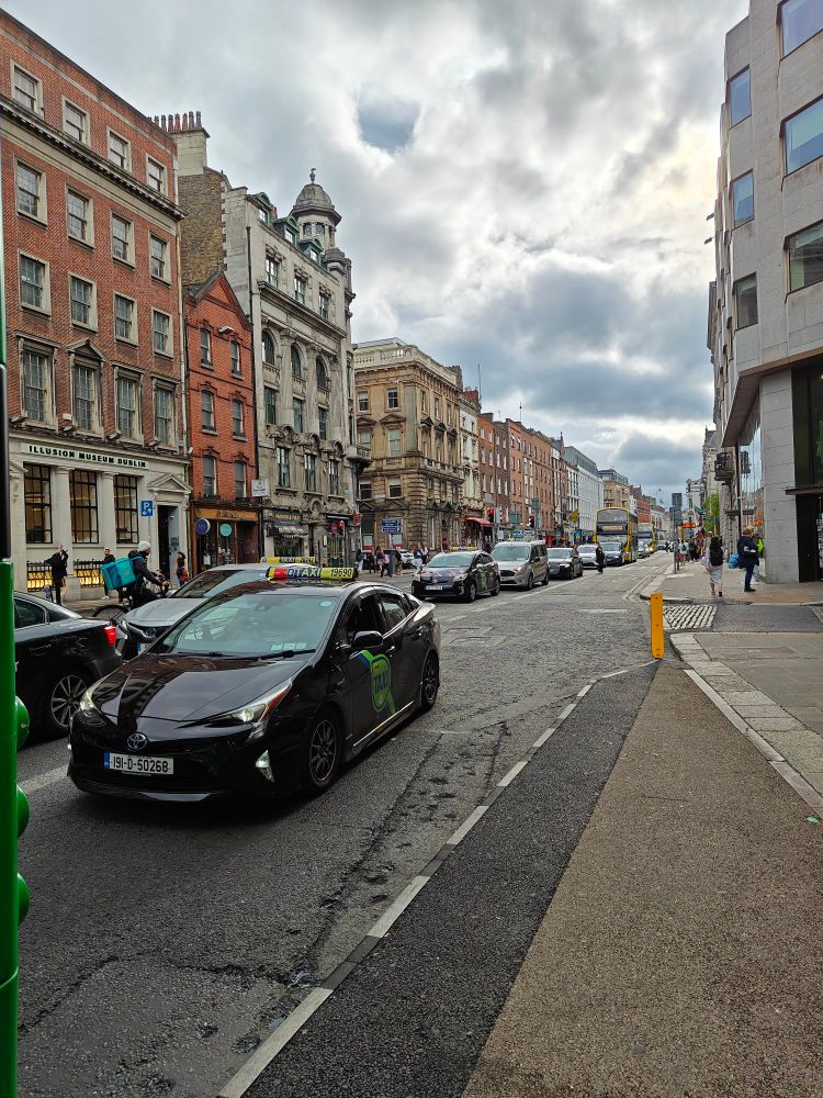 Dame Street leading up to College Green
The road is full of taxis holding up public transportation