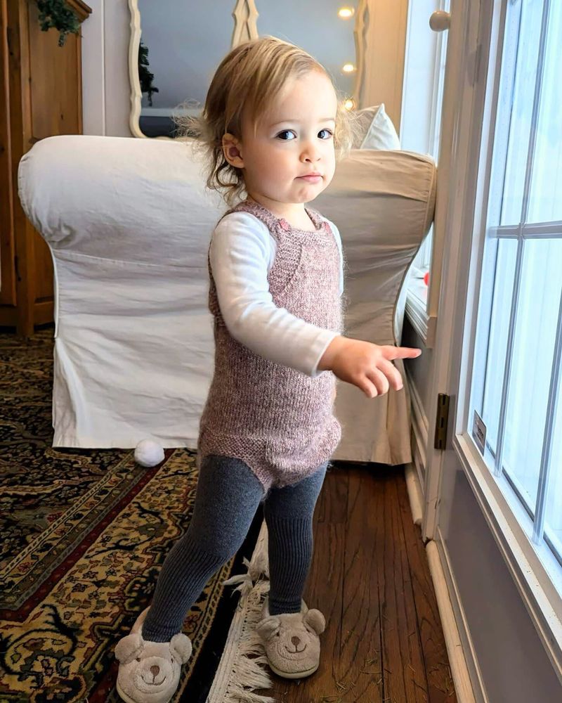 Toddler wearing a knitted jumper