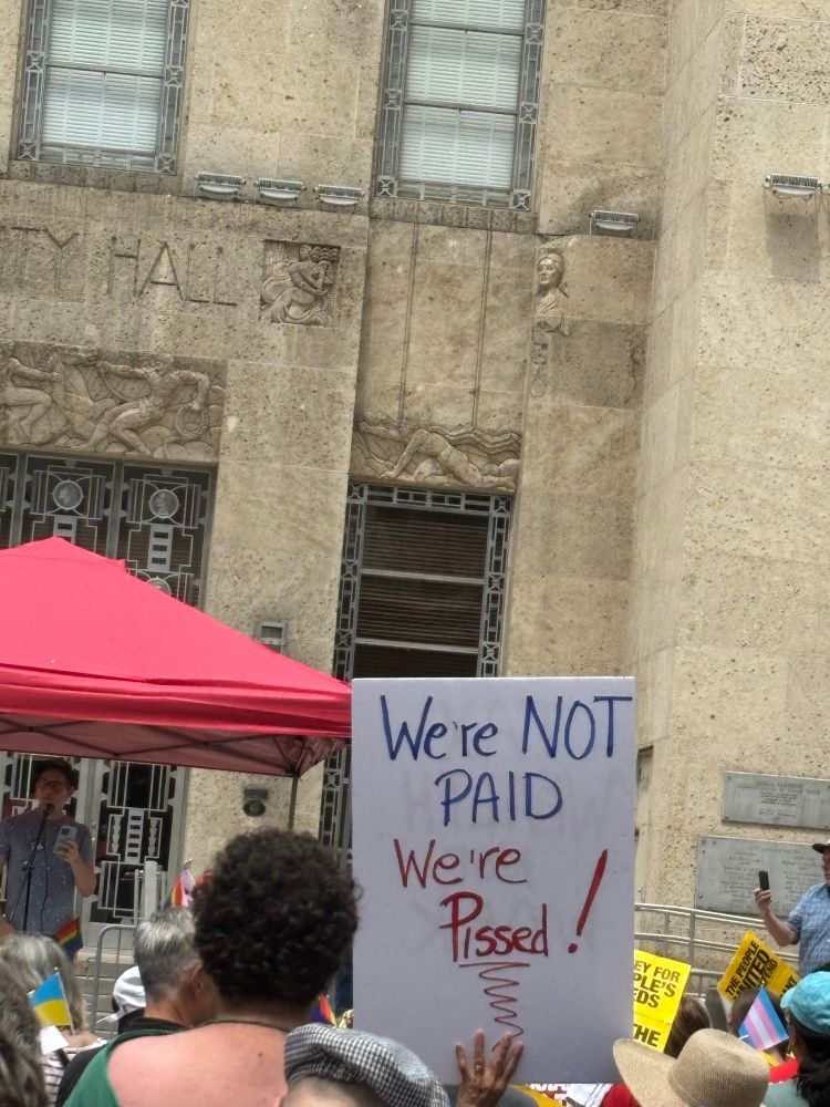 We’re not paid,we’re pissed! sign at 50501 protest in Houston