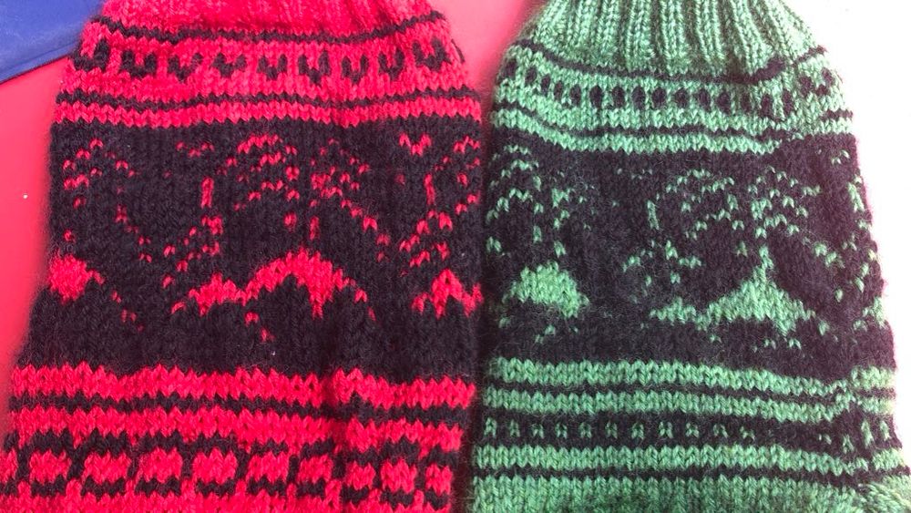 Red and green socks that show erupting volcanoes 