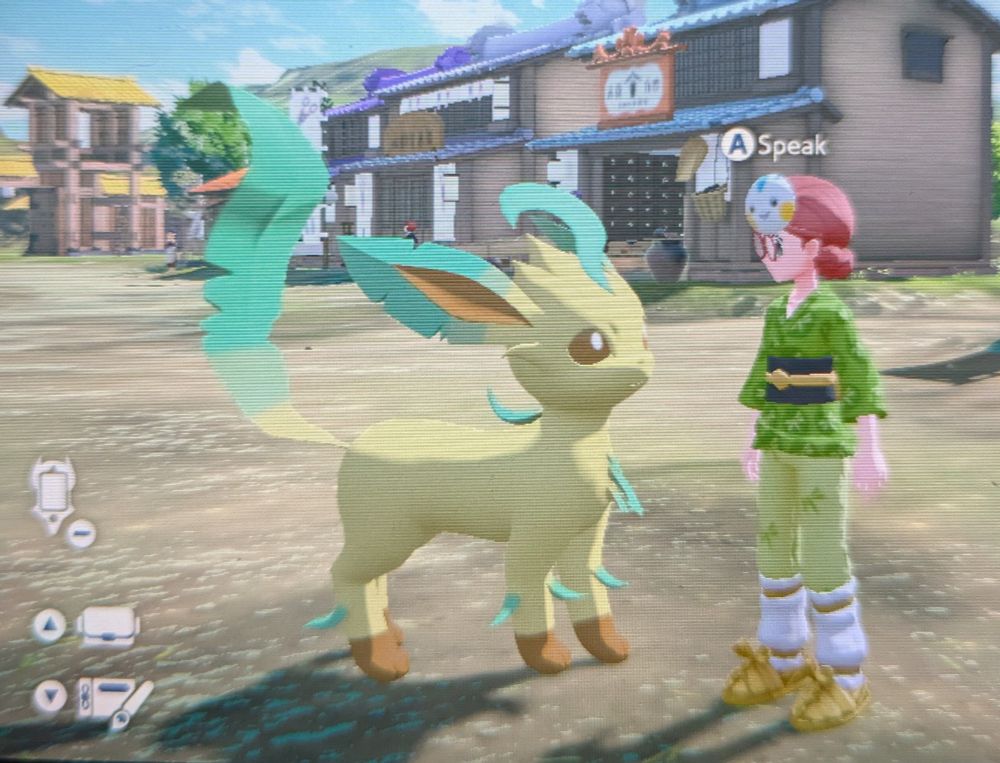 screengrab from Pokemon Arceus showing the player character standing next to the biggest fucking leafeon ever