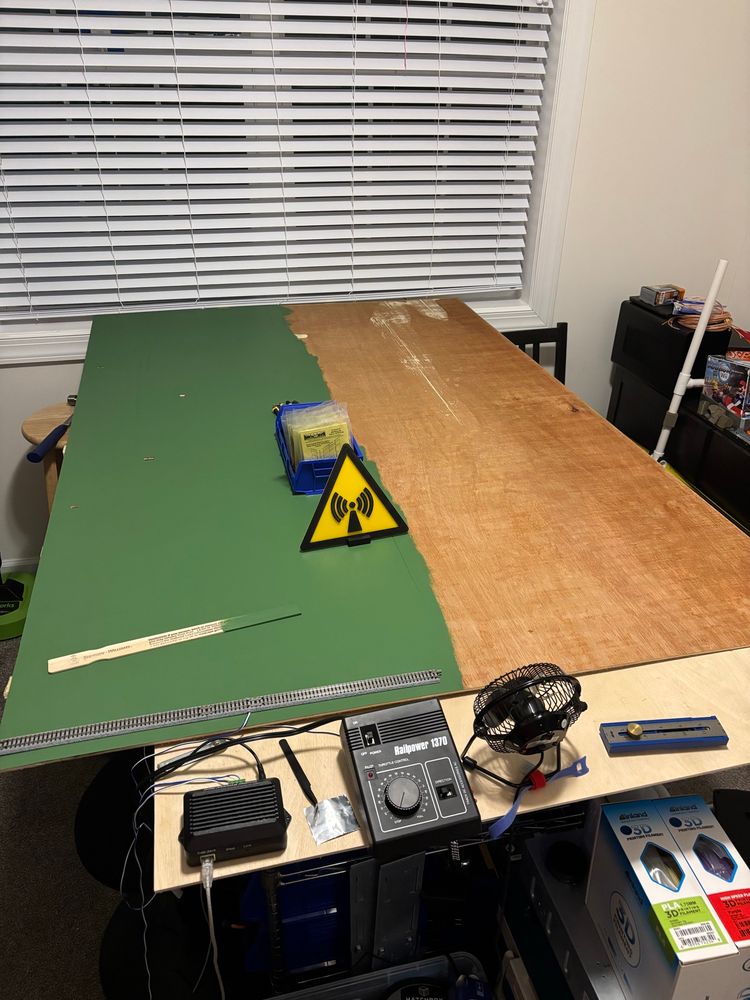 Same board, without the track layout.  Half of the base board is painted a green grass color.