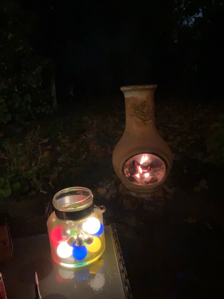 Hurricane lamp full of coloured bulbs by the chininea