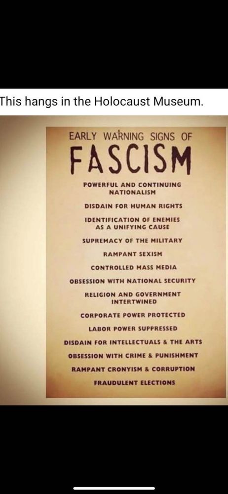 A sign from The Holocaust Museum warning of the early signs of fascism. Identifying enemies as a unifying cause, disdain for intellectuals  and the arts, rampant cronyism are among the items listed.