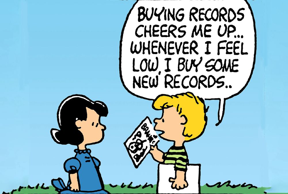 Peanuts comic strip, Lucy in front of Linus, Linus holding a record saying: Buying records cheers me up… whenever i feel low, i buy some new records….