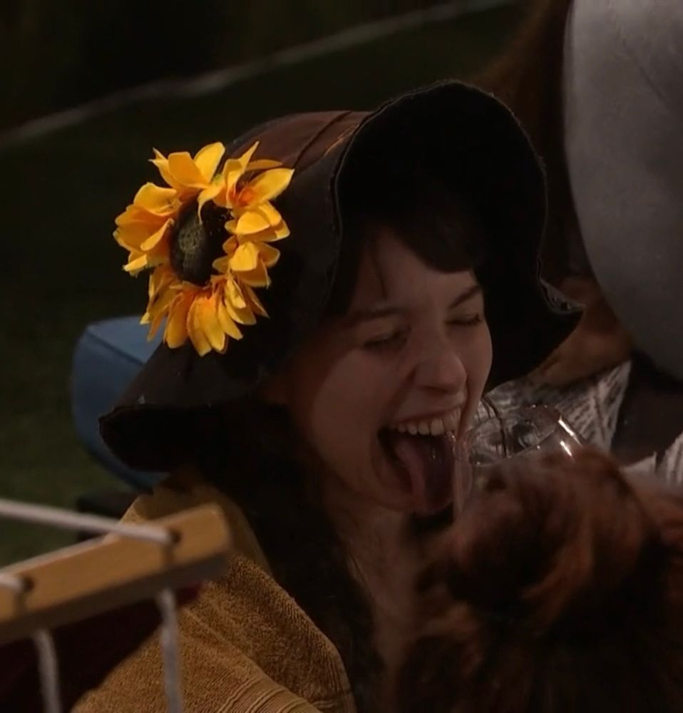 ava closing her eyes and sticking her wine-stained tongue out by the hammock on day 13