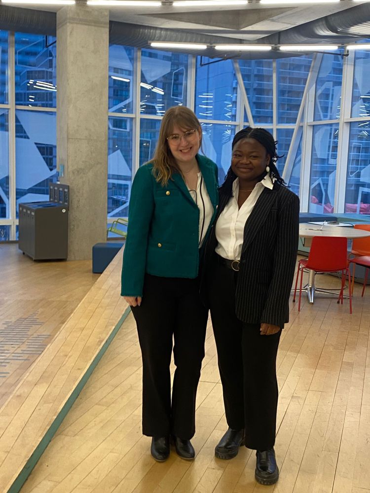 Me wearing a green tweed blazer which is very Hillary Clinton core and my beautiful mooting partner Ayo 