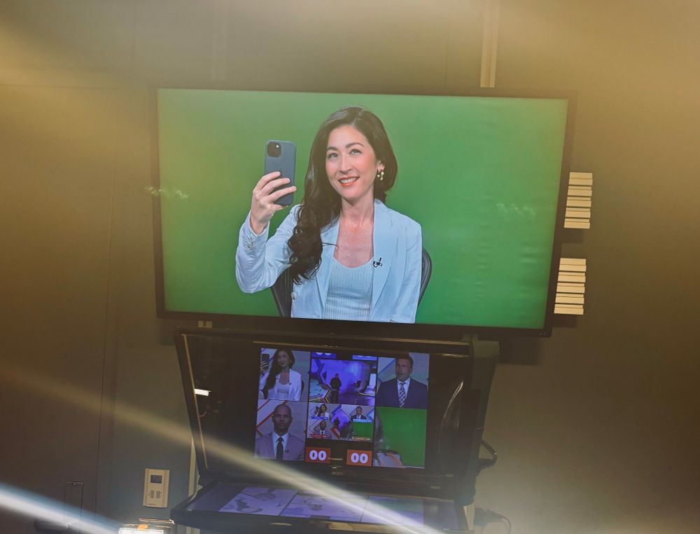 Selfie in front of green screen 