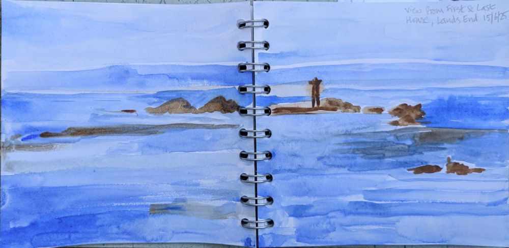 This is a landscape I painted while visiting Lands End in Cornwall at the weekend. It is a view of the sky and sea interrupted by a range of rocks. The sky and sea are in shades of blue and the rocks are brown. It is painted using watercolour on cartridge paper.