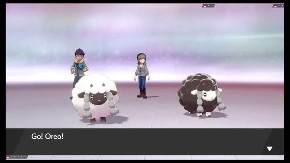 A screenshot from Pokemon Sword. A normal and a shiny Wooloo stand side-by-side in battle.