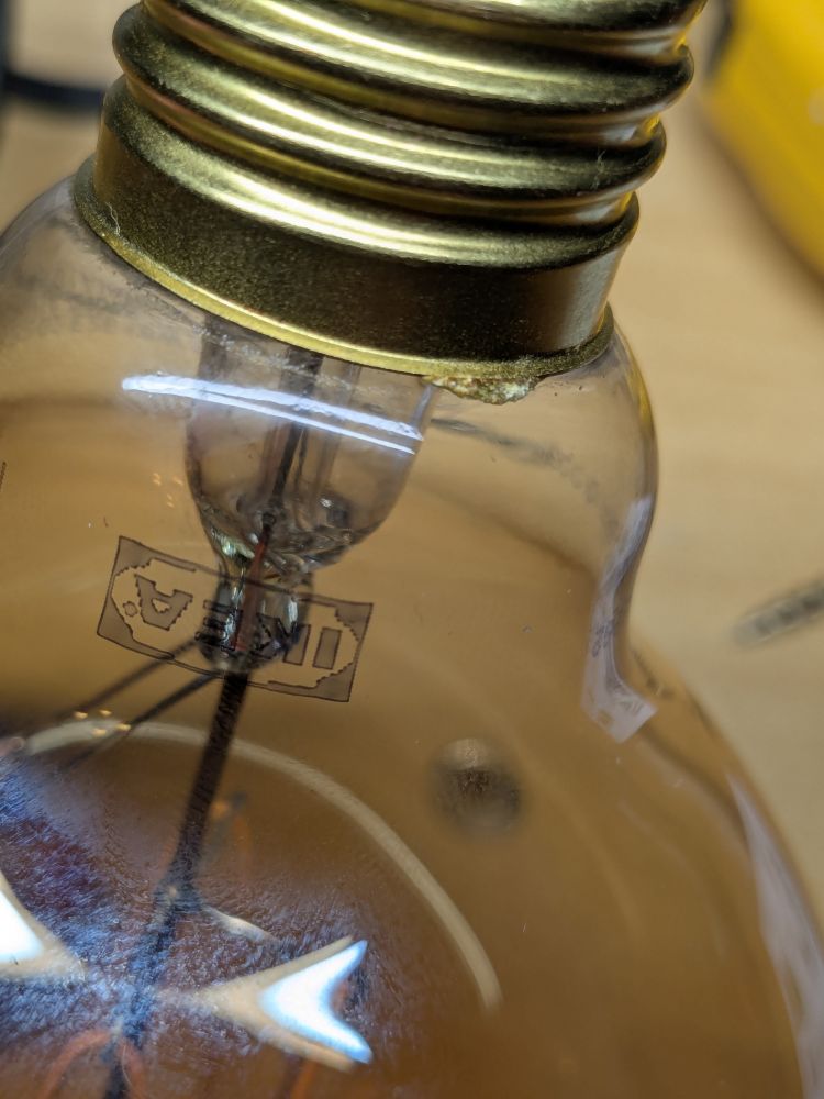 Excess glue seen oozing out between the metal and glass