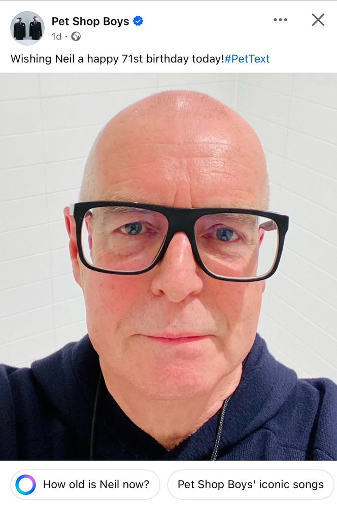 Facebook post from Pet Shop Boys’ official page showing Neil Tennant’s big mug in a selfie and the words “Wishing Neil a happy 71st birthday today!” Below it the Meta AI bubble asks “How old is Neil now?”