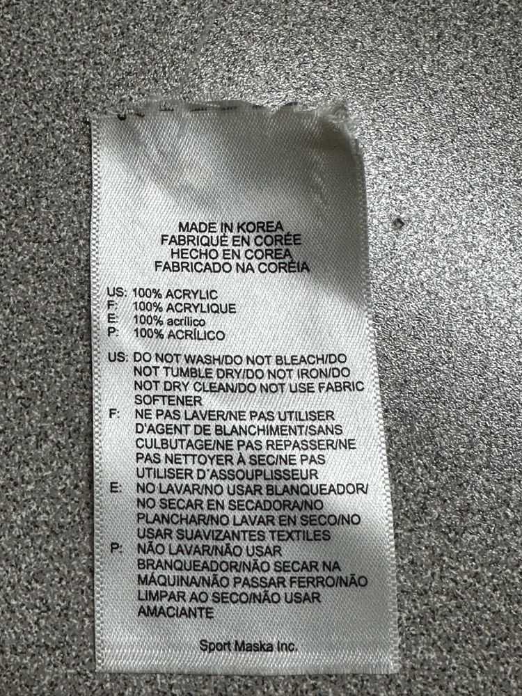 a picture of a tag from a piece of clothing. The tag reads, “
US: DO NOT WASH/DO NOT BLEACH/DO NOT TUMBLE DRY/DO NOT IRON/DO NOT DRY CLEAN/DO NOT USE FABRIC SOFTENER”