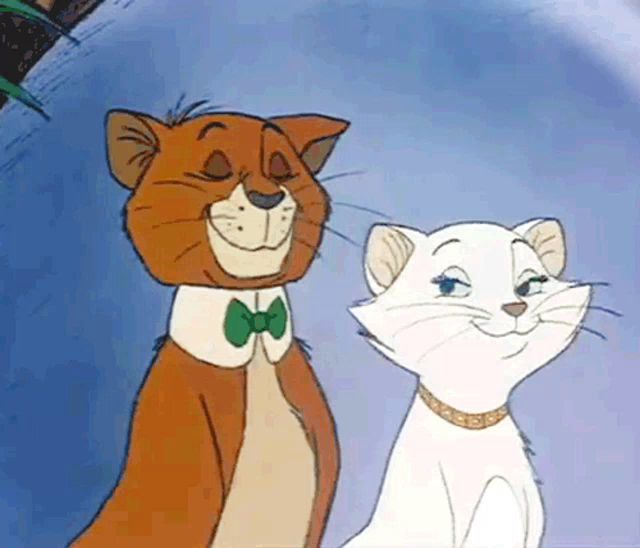 a cartoon cat with a bow tie and a white cat with a collar