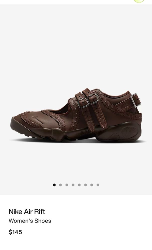 A pair of brown Nike shoes that looks very out of place.