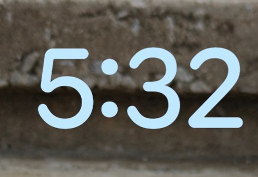 5:32 on a lock screen in rounded babyish font