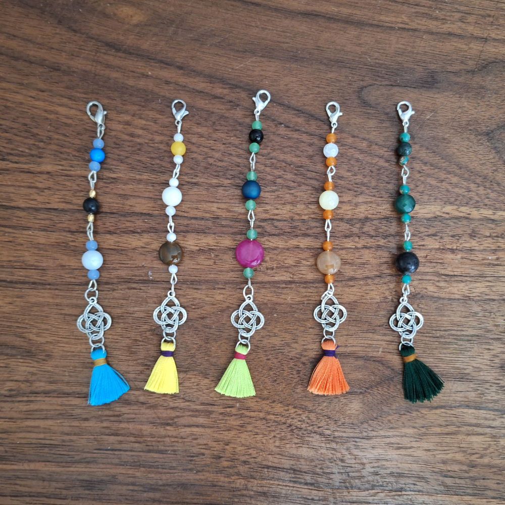 Handmade phone charms of the following Genshin characters:
#wanderergenshin

#ningguang

#tighnari

#yoimiya

#alhaitham
