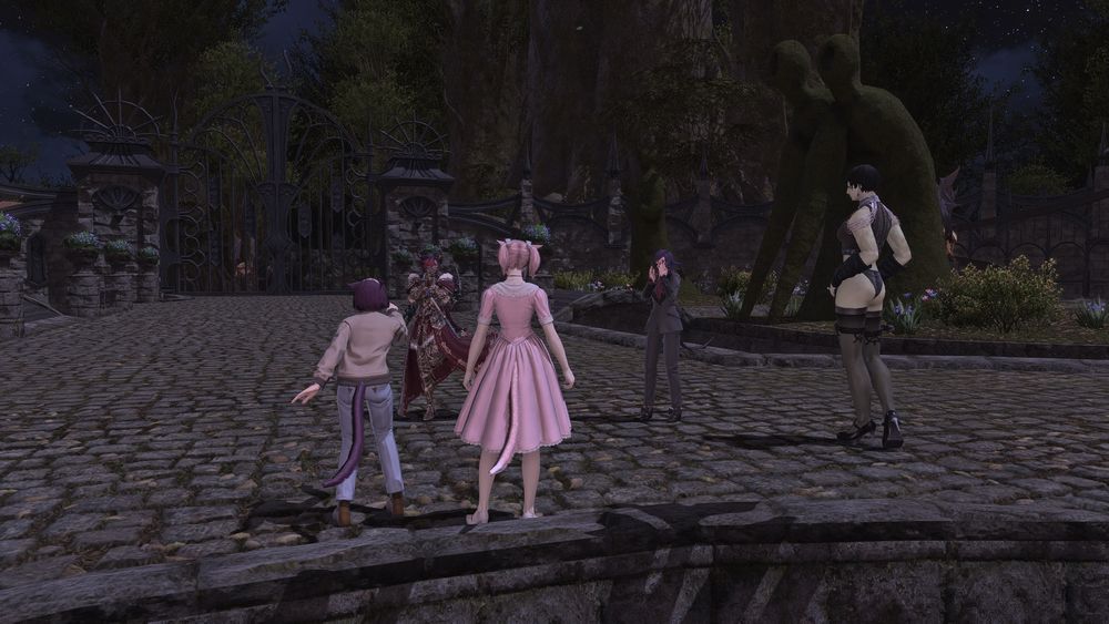 screenshot of ffxiv ingame at haukke manor, various player characters are gathered and emoting at each other while dressed as characters from the Rocky Horror Picture Show