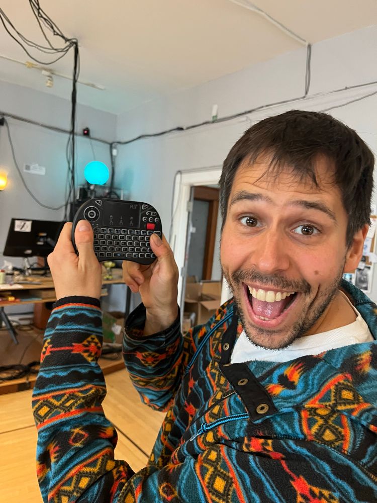 Someone is overjoyed to have a mini wireless keyboard and trackpad for working with Rpii