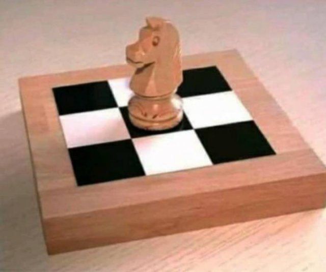 A chessboard with only 9 spaces and a knight placed in its center. 