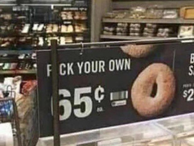 A "PICK YOUR OWN" bagel sign with the 'i' obscured, as well as part of the "P," creating the appearance of quite a different message.