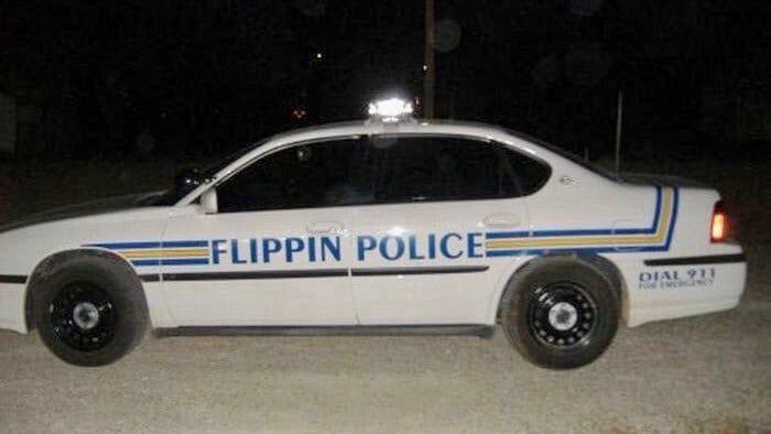 Patrol vehicle marked “FLIPPIN POLICE.”