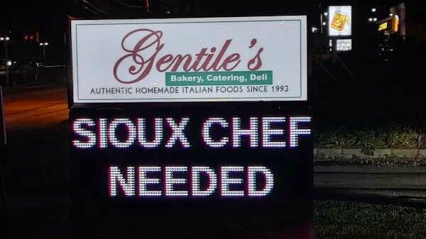 Restaurant sign advertising “SIOUX CHEF NEEDED.”