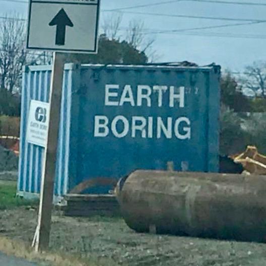 Dumpster labeled “EARTH BORING.”