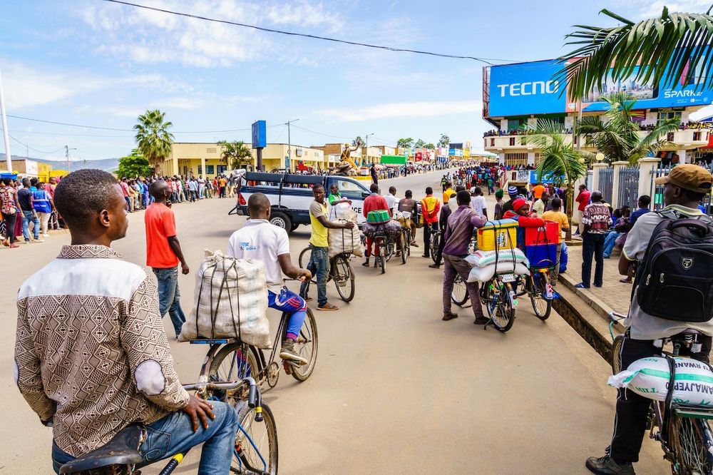People gather to watch a cycling race in Muhanga, Rwanda. Credit: Alexey Stiop / Alamy Stock Photo
