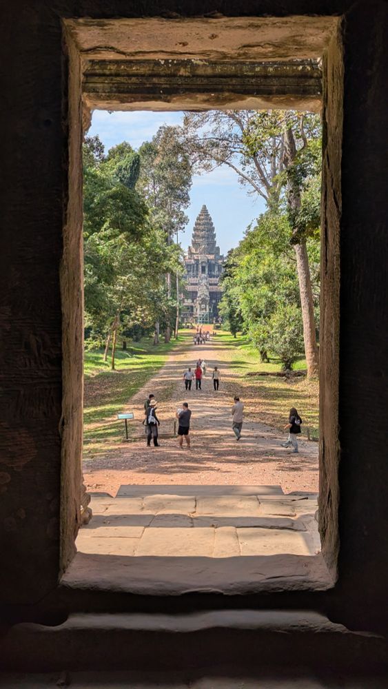 Angkor Wat spire framed within a window of another temple
