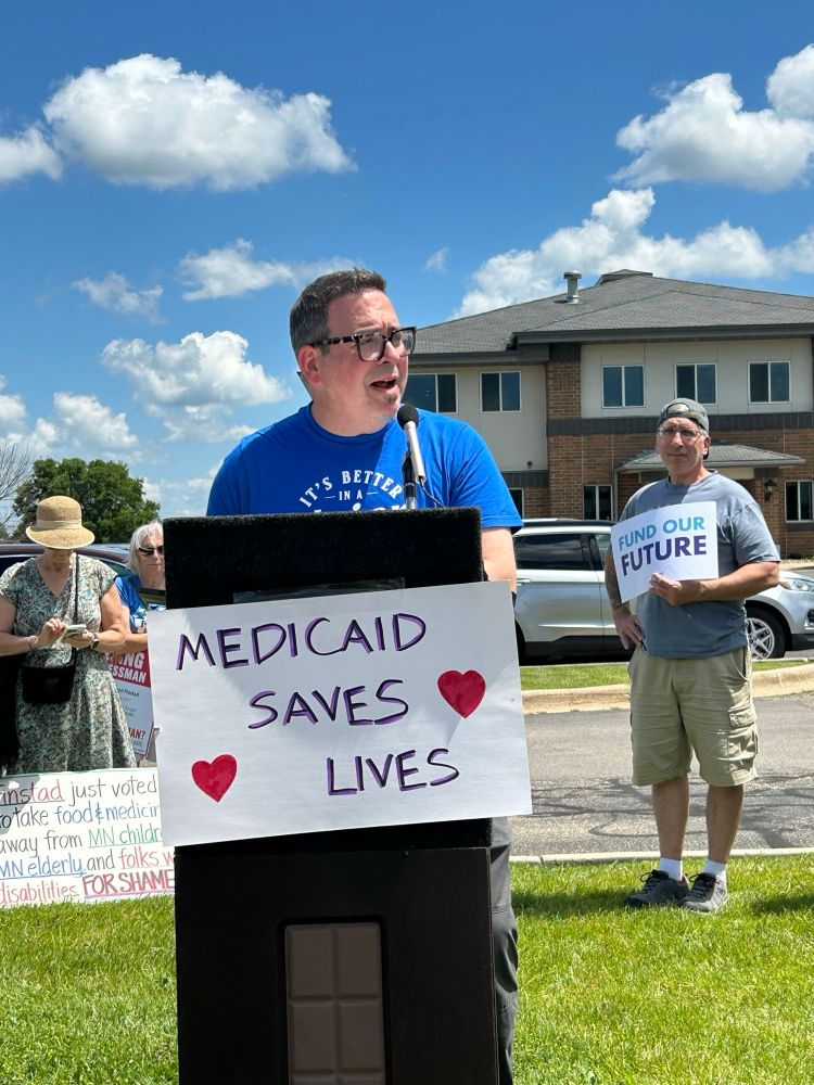 MN State Senate Candidate and educator Simon Glaser demanding a tax and spending law that represents our values of care for all, not just the billionaires.